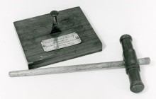 Gavel in form of a caulking iron and mallet